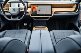 Rivian will launch hands-off highway driver assist...